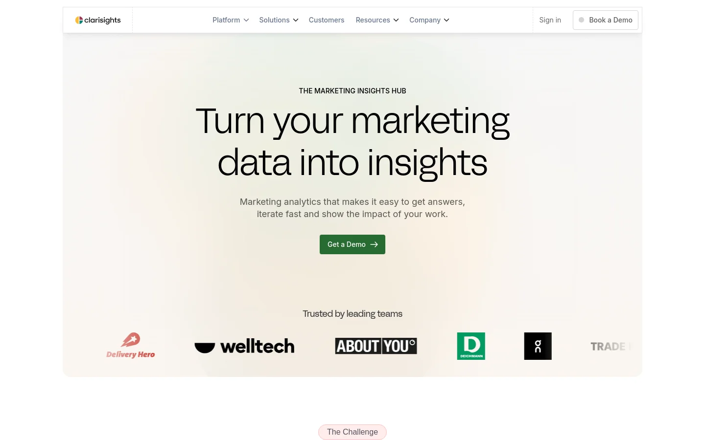The desktop homepage features a clean, minimalist design with a light beige background. A large centered headline reads 'Turn your marketing data into insights' above a subheadline and a dark green 'Get a Demo' call-to-action button. Below this, a 'Trusted by leading teams' section displays several company logos in a horizontal row.