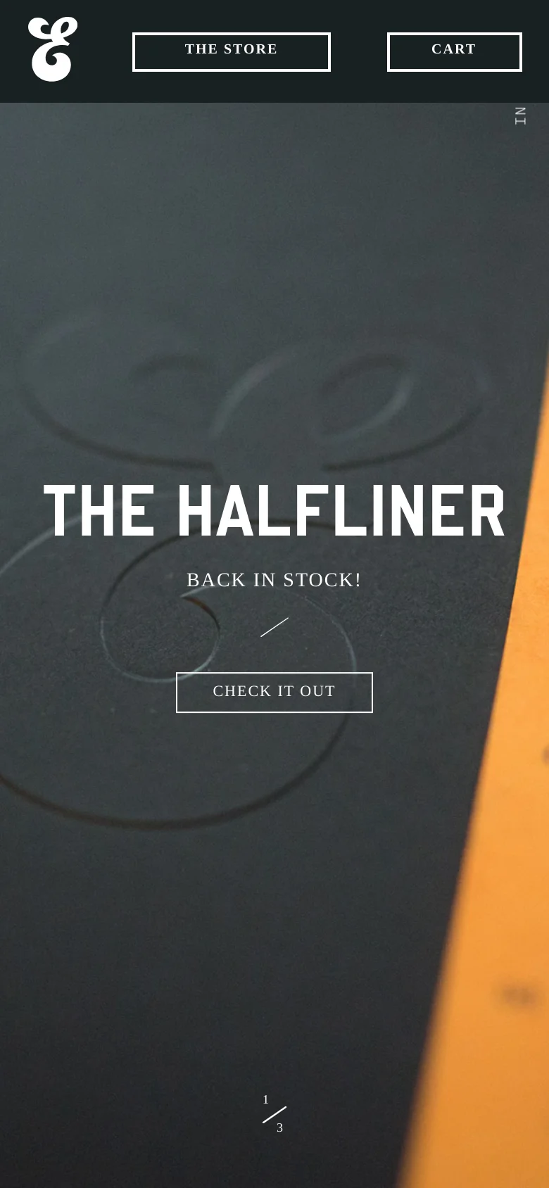 The mobile version presents a simplified, vertically stacked layout optimized for small screens. The hero section dominates the view with large white text reading 'THE HALFLINER' and a 'CHECK IT OUT' button over a dark background. A navigation bar at the top includes the brand logo, 'THE STORE', and 'CART' buttons.