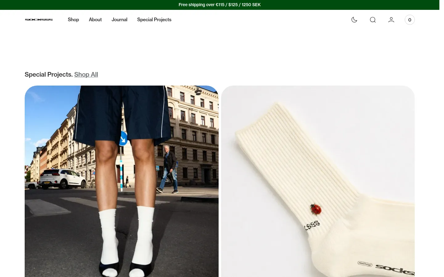 The desktop homepage features a clean, minimalist white layout with a top navigation bar containing links for Shop, About, Journal, and Special Projects. Below a green announcement bar, a 'Special Projects' section displays large, high-quality lifestyle images of socks, including a person wearing white socks on a city street and a close-up of a cream-colored sock with a ladybug detail. A product grid follows, showcasing individual sock models like Cloud, Heather, and Ash with prices and quick view options.