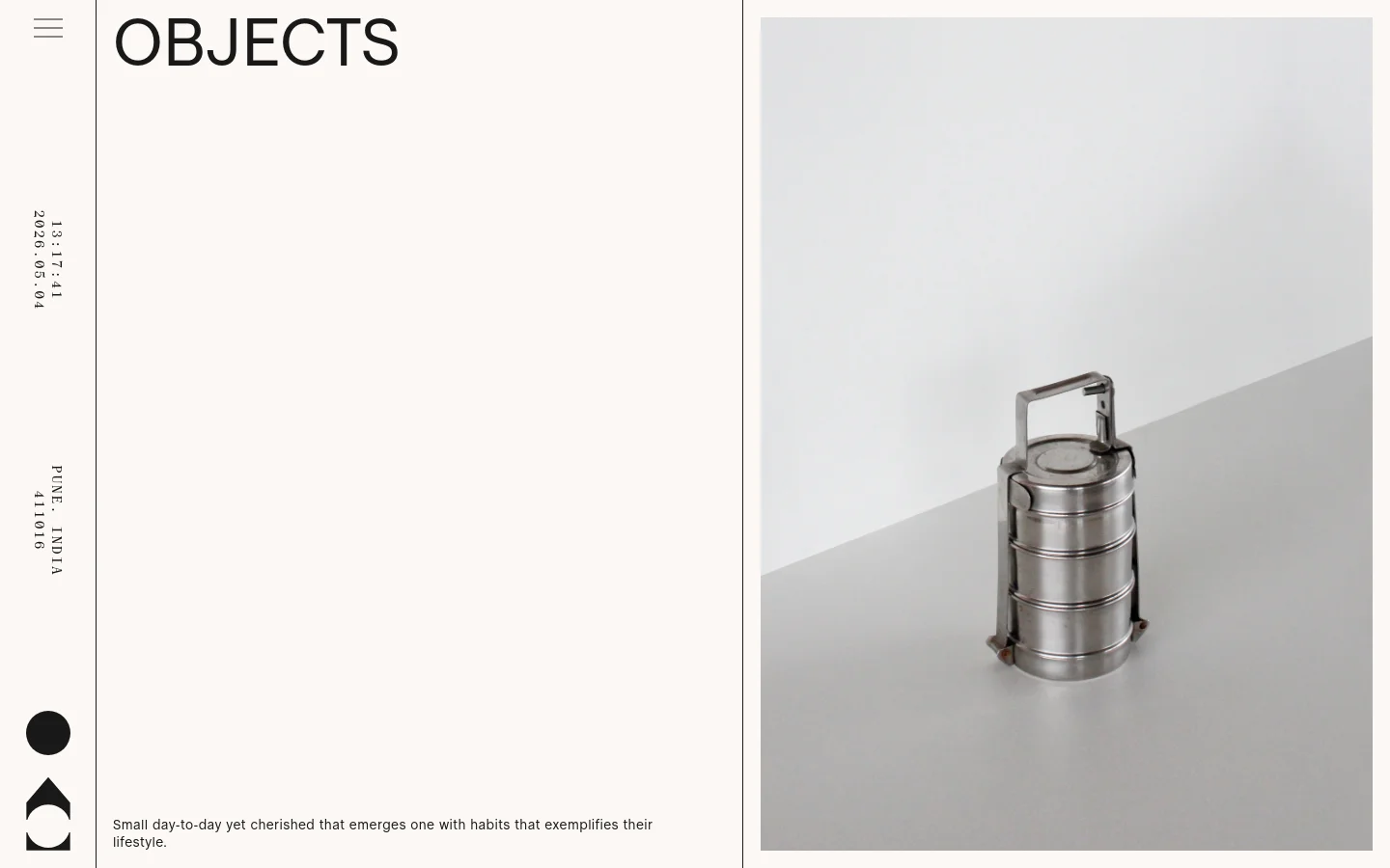 The desktop page features a minimalist design with a large 'OBJECTS' headline and a vertical sidebar containing text and geometric shapes. A large hero image on the right shows a stainless steel tiered container against a neutral, light gray background. The layout uses ample white space and a clean, sophisticated aesthetic.