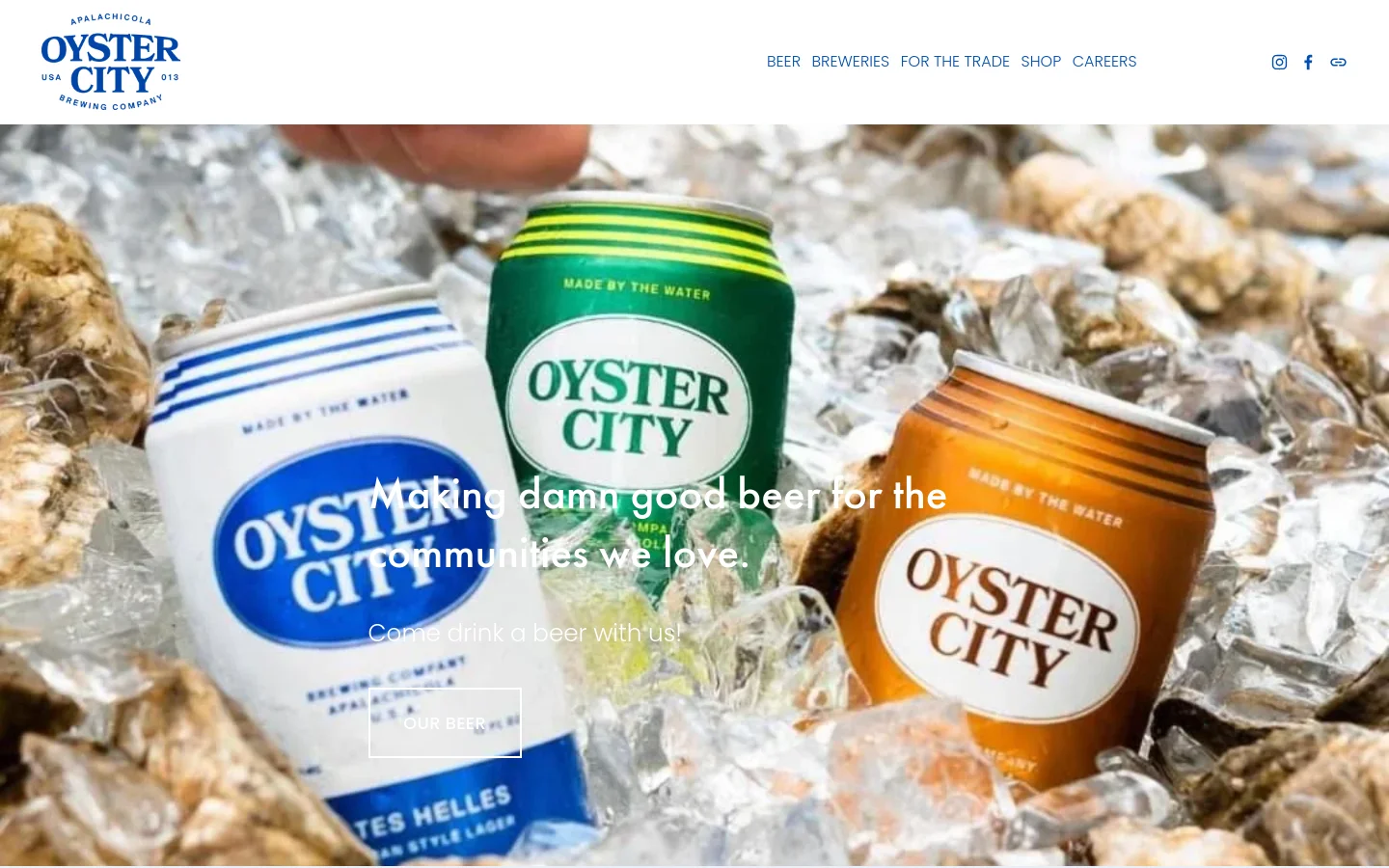 The desktop homepage features a large hero image of three beer cans nestled in ice and oyster shells, overlaid with the headline 'Making damn good beer for the communities we love' and an 'OUR BEER' call-to-action button. A white navigation bar at the top contains the Oyster City Brewing Co. logo, links for Beer, Breweries, For the Trade, Shop, and Careers, and social media icons. The layout is spacious with a clean, white background used for subsequent content sections.