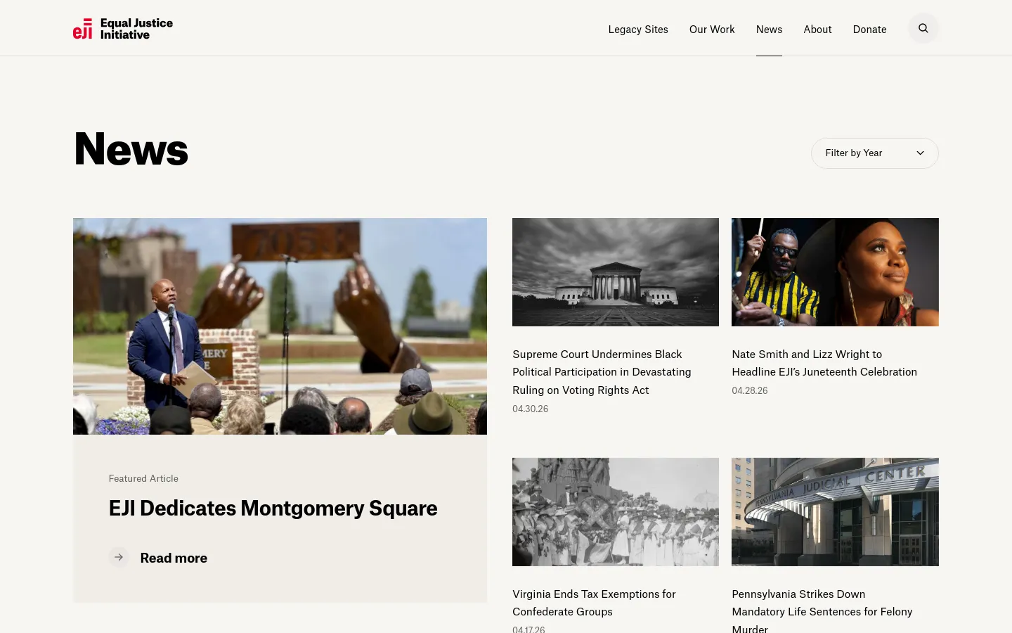 The News page features a large 'News' heading and a 'Filter by Year' dropdown menu. A prominent featured article section shows a large photograph of a man speaking at a podium, titled 'EJI Dedicates Montgomery Square' with a 'Read more' call to action. Below this, news stories are arranged in a grid layout with images and headlines on a light grey and white background.