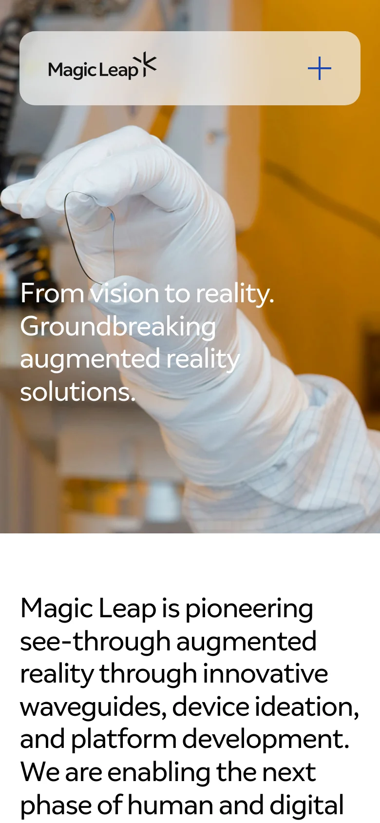The mobile version simplifies the layout, replacing the top navigation bar with a compact header containing the Magic Leap logo and a large plus icon for the menu. The hero section prominently displays the main headline over the lab imagery, followed by the introductory text block. The content is stacked vertically for easy scrolling on smaller screens.