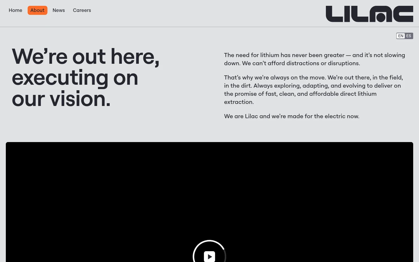 The desktop About page features a minimalist design with a light gray background and black text. A large headline, 'We’re out here, executing on our vision,' sits on the left, balanced by mission statement text on the right, above a large video player area. The top navigation includes links for Home, About, News, and Careers, alongside the Lilac logo and a language switcher.