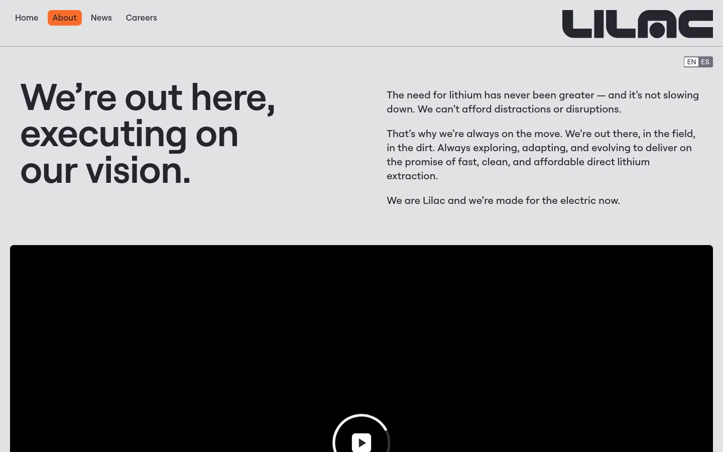 The desktop About page features a minimalist design with a light gray background and black text. A large headline, 'We’re out here, executing on our vision,' sits on the left, balanced by mission statement text on the right, above a large video player area. The top navigation includes links for Home, About, News, and Careers, alongside the Lilac logo and a language switcher.
