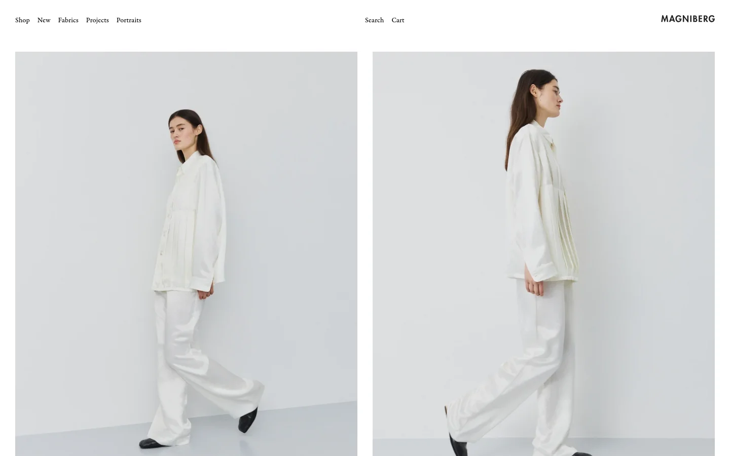The Magniberg homepage features a minimalist design with a white background and a clean navigation menu at the top. The hero section displays two large, side-by-side vertical images of a woman wearing white loungewear against a light grey background. The layout is spacious and high-end, emphasizing lifestyle photography.