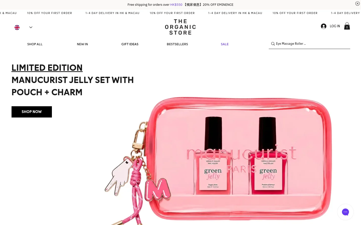The desktop homepage features a clean, white layout with a large hero image of a pink Manucurist Jelly Set in a translucent pouch. A black 'SHOP NOW' button sits next to the headline, while a navigation menu above includes links for Shop All, New In, Gift Ideas, Bestsellers, and Sale. Below the hero section, a grid of circular product category images displays skin concerns like Eczema-Prone and Oily & Acne.