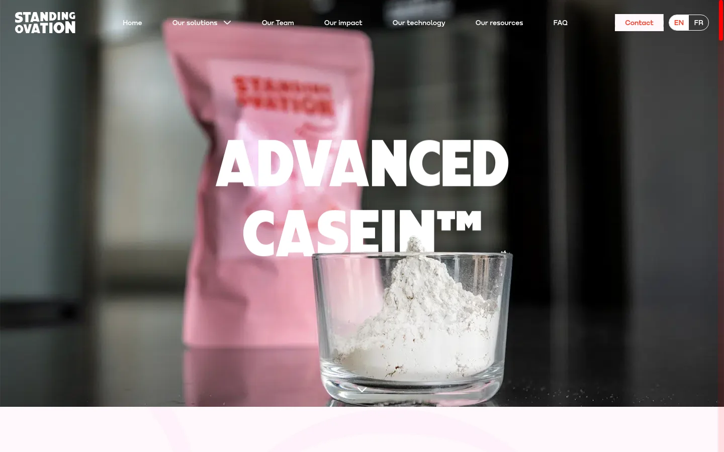 The desktop landing page features a large hero image of a glass bowl filled with white protein powder in front of a pink package, with the headline 'ADVANCED CASEIN™' in bold white text. A white navigation bar at the top includes links for 'Our solutions', 'Our team', and a 'Contact' button. The overall color palette is professional with dark, moody tones in the background and bright white typography.