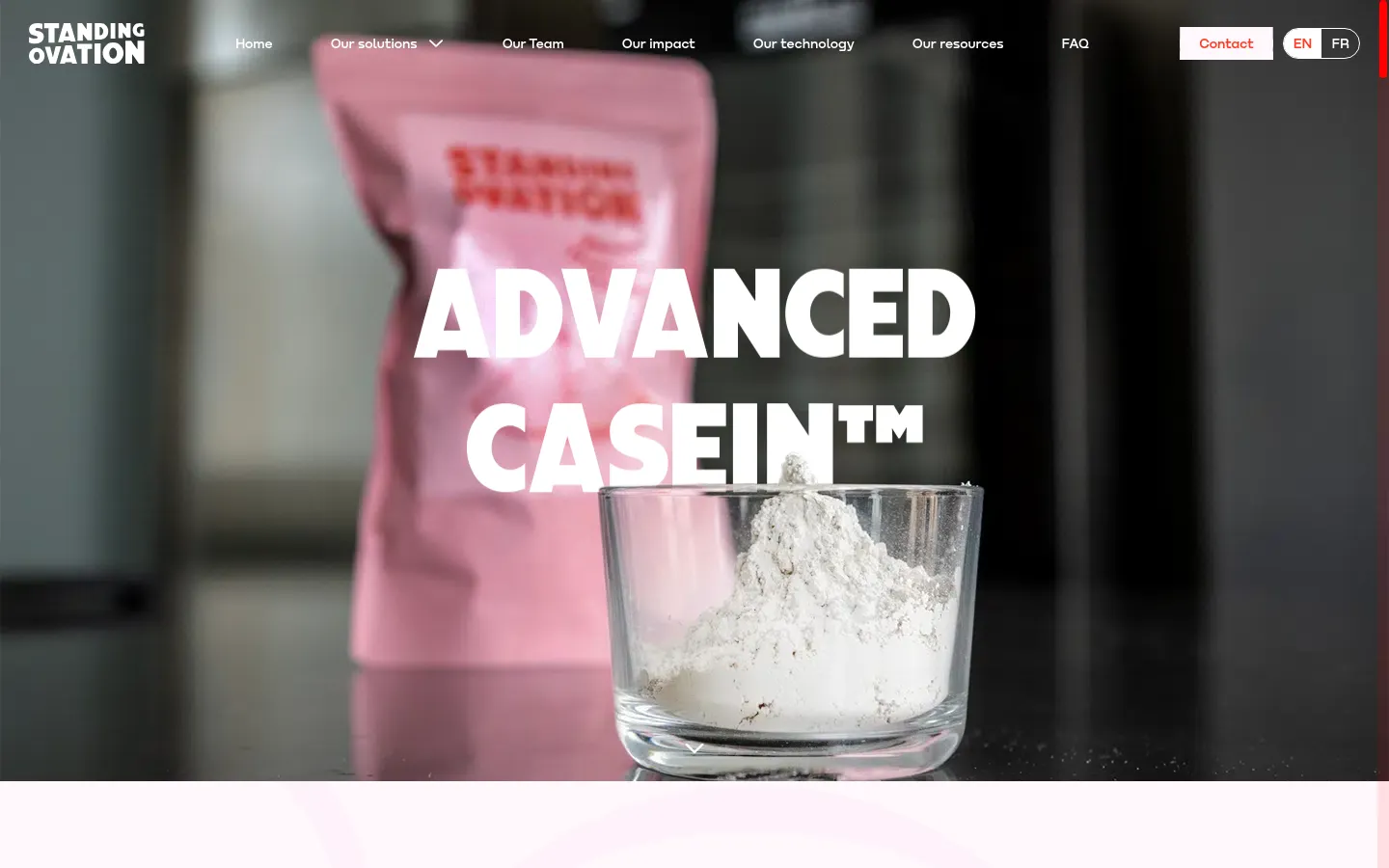 The desktop landing page features a large hero image of a glass bowl filled with white protein powder in front of a pink package, with the headline 'ADVANCED CASEIN™' in bold white text. A white navigation bar at the top includes links for 'Our solutions', 'Our team', and a 'Contact' button. The overall color palette is professional with dark, moody tones in the background and bright white typography.