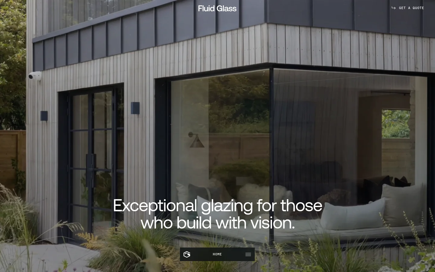 The desktop homepage features a full-width hero image of a modern wooden building with large glass windows. The headline 'Exceptional glazing for those who build with vision' is centered over the image, with a 'Get a quote' call to action in the top right and a navigation bar at the bottom containing the logo and a menu icon.