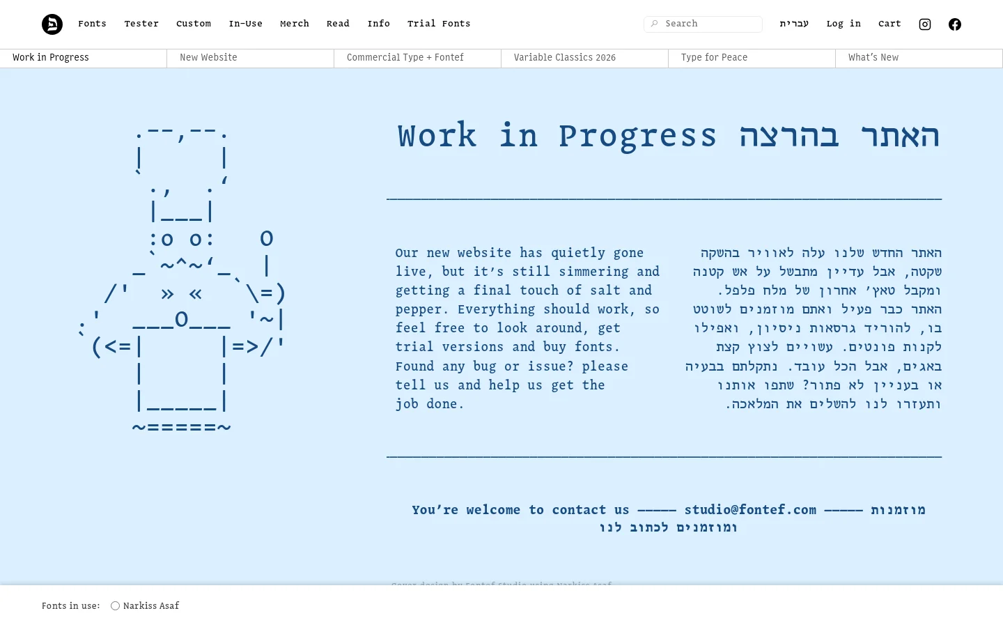 The desktop homepage features a minimalist light blue background with a large ASCII art graphic on the left. A prominent headline reads 'Work in Progress' in both English and Hebrew, followed by two columns of descriptive text in English and Hebrew. The navigation bar at the top includes links for Fonts, Tester, and Custom, alongside a search bar and social media icons.