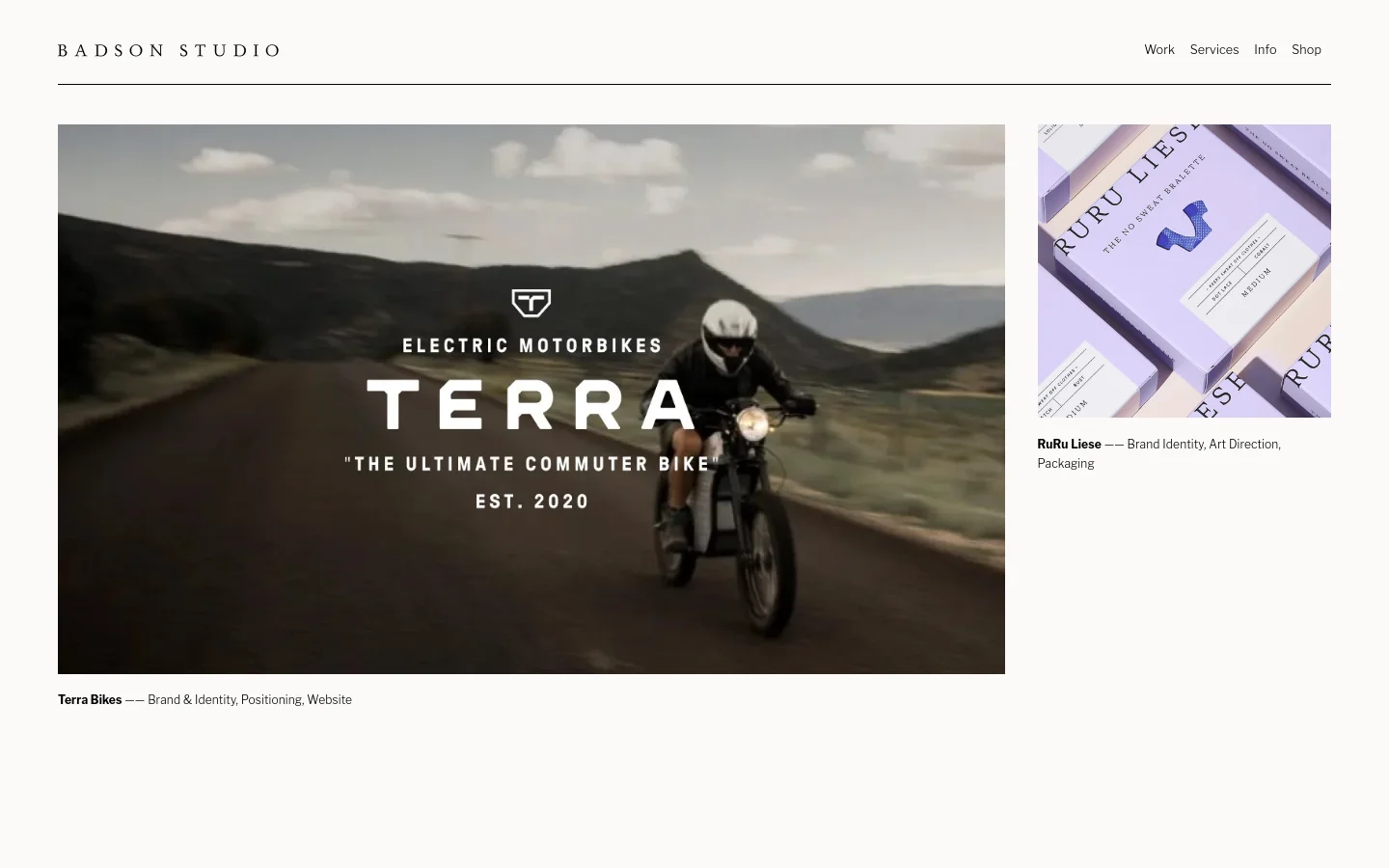 The Badson Studio homepage features a minimalist white background with a clean navigation menu at the top. A large hero section displays a project for Terra Bikes, showing a person riding an electric motorbike on a road with mountain scenery and bold white text overlays. Below, a grid of portfolio projects like RuRu Liese is presented with large high-quality images and descriptive text.