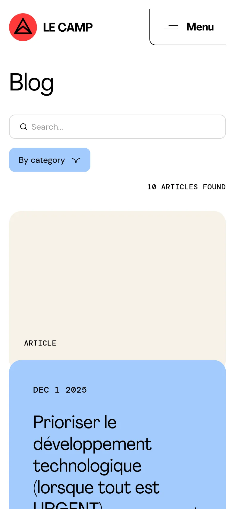 The mobile version simplifies the layout into a single-column vertical scroll, prioritizing the search bar and category dropdown at the top. The blog posts appear as large, stacked cards where the image is followed by the article metadata and headline. The header is condensed, featuring the LE CAMP logo and a prominent 'Menu' button.