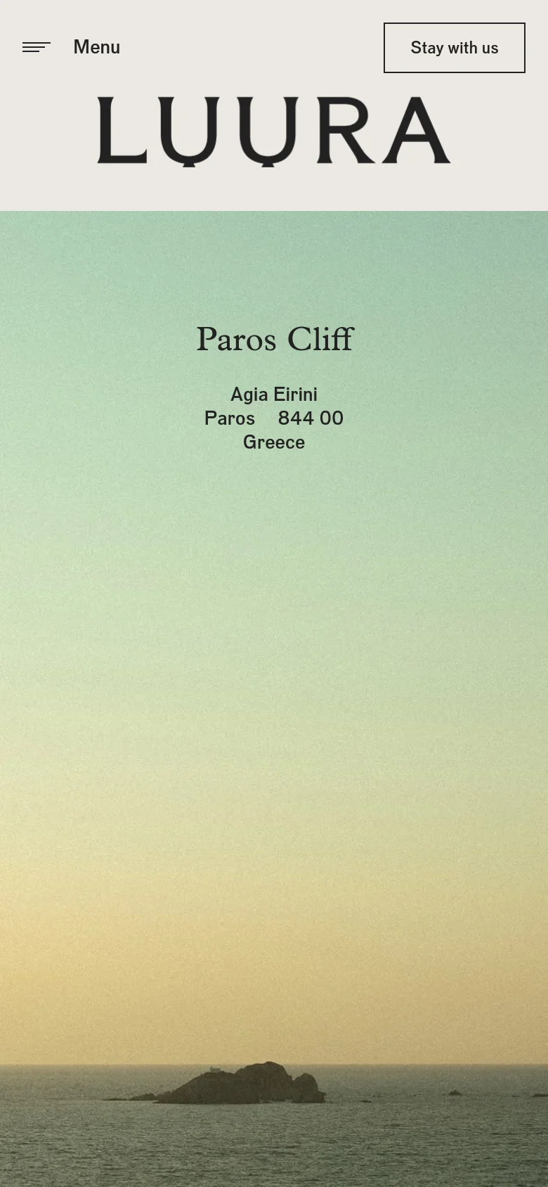 The mobile version presents a simplified layout with a hamburger menu icon and 'Menu' text on the left, and the 'Stay with us' button on the right. The 'LUURA' logo is centered above the 'Paros Cliff' headline and address, which are set against the same gradient background as the desktop view.