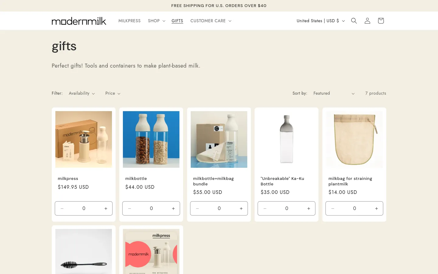 The desktop page features a minimalist design with a cream background and a header containing the ModernMilk logo and navigation links. A large 'gifts' heading is followed by a brief description, filter and sort options, and a grid of product cards showing items like the milkpress and milkbottle with their prices and quantity selectors. The layout is spacious with a clean, professional aesthetic.