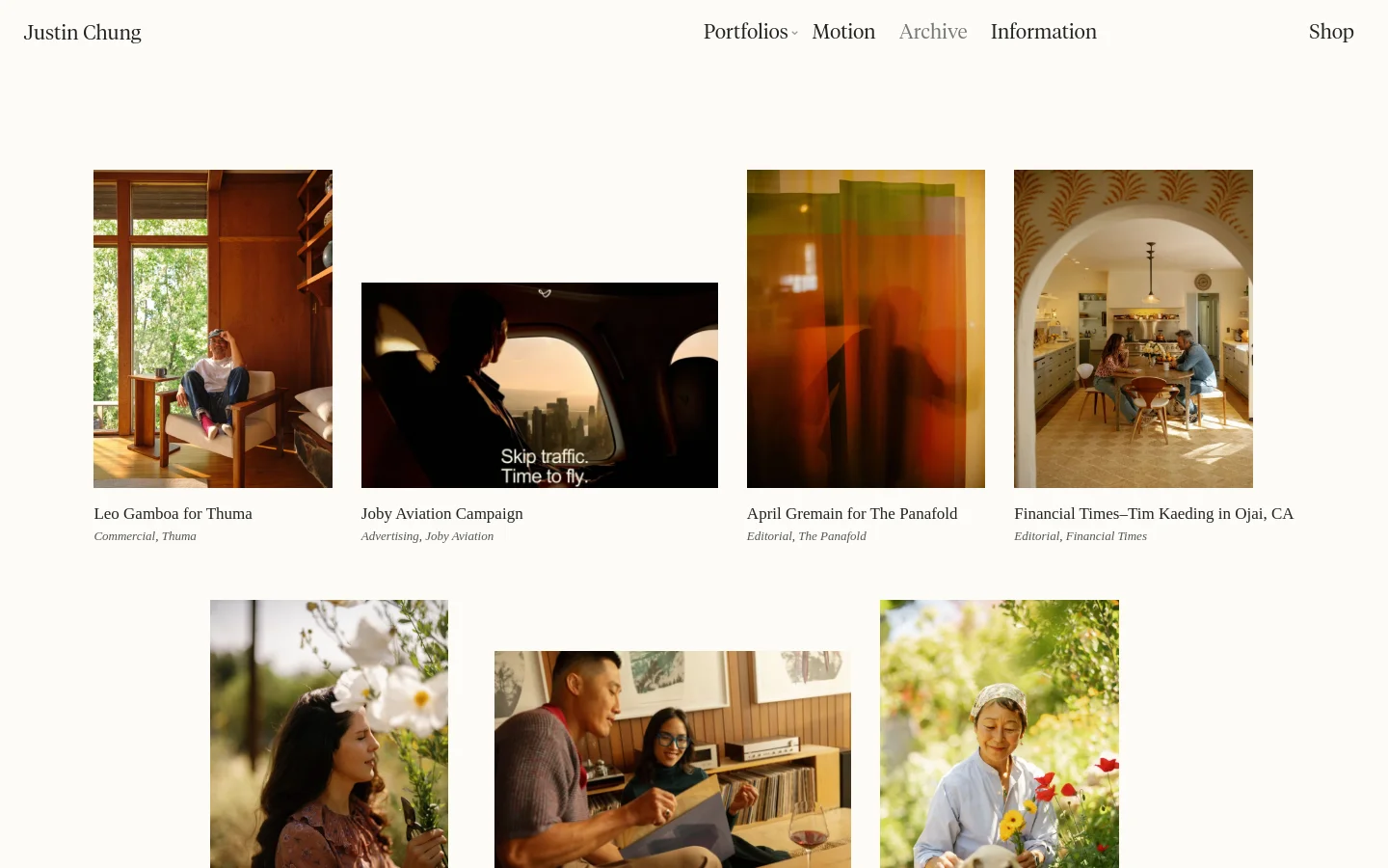 The desktop Archive page features a minimalist white layout with a top navigation bar containing links for Portfolios, Motion, Archive, Information, and Shop. Below the header, a grid of large, vertical and horizontal photography thumbnails displays various projects, each accompanied by a title and category description in black text.
