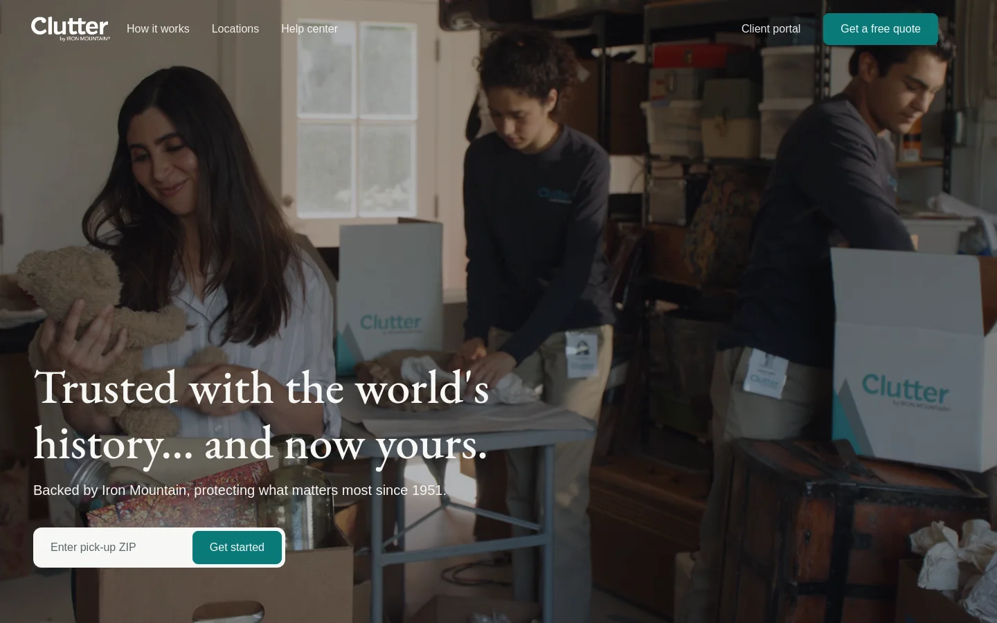 The Clutter homepage features a large hero image of a woman holding a teddy bear while staff members pack boxes in the background. A bold headline reads 'Trusted with the world's history... and now yours,' followed by a subheadline and a call to action consisting of a ZIP code input field and a teal 'Get started' button. The navigation bar at the top includes links for 'How it works,' 'Locations,' and 'Help center,' alongside a 'Get a free quote' button.
