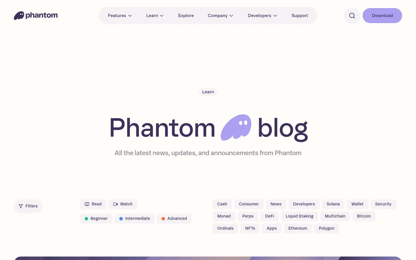 Phantom blog page featuring a minimalist dark and light UI with a large centered headline. A comprehensive tag filtering system sits below the header, followed by a featured article card with a purple graphic and bold typography. The design uses a clean, spacious layout with soft rounded corners and subtle grayscale accents.