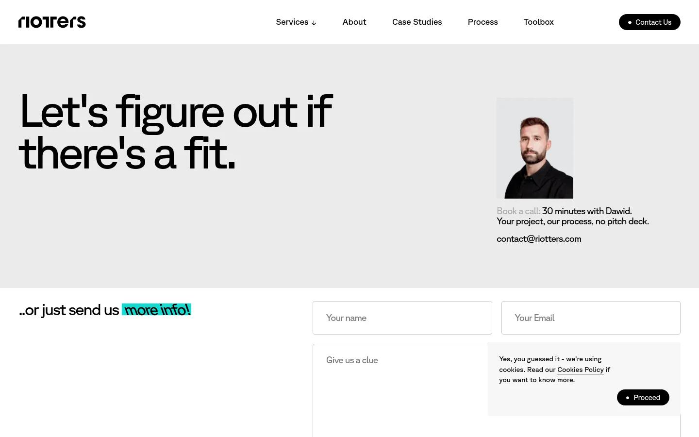The desktop page features a minimalist light gray background with a large headline reading 'Let's figure out if there's a fit.' To the right is a portrait of a man named Dawid, followed by booking information and an email address. Below, a contact form with fields for name, email, and message is positioned next to the text '..or just send us more info!'