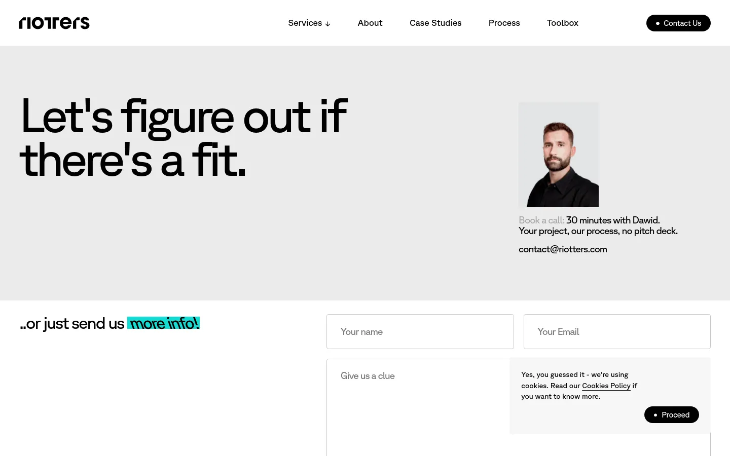 The desktop page features a minimalist light gray background with a large headline reading 'Let's figure out if there's a fit.' To the right is a portrait of a man named Dawid, followed by booking information and an email address. Below, a contact form with fields for name, email, and message is positioned next to the text '..or just send us more info!'