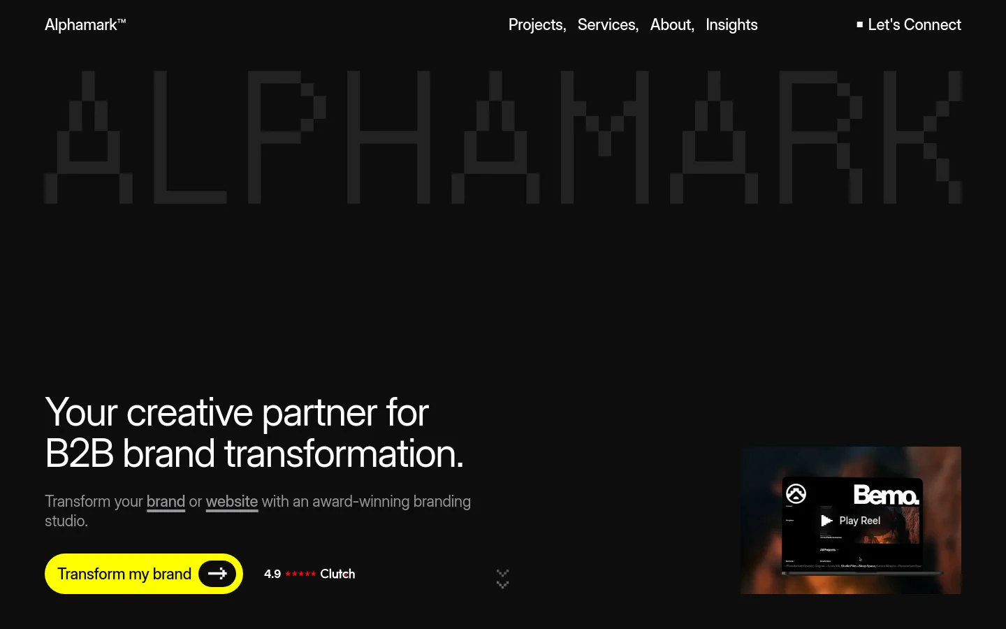 The desktop homepage features a dark, minimalist aesthetic with a large, pixelated 'ALPHAMARK' watermark in the background. The hero section displays the headline 'Your creative partner for B2B brand transformation' next to a video reel preview, with a prominent yellow 'Transform my brand' call-to-action button. Navigation links for Projects, Services, About, and Insights are positioned at the top right.