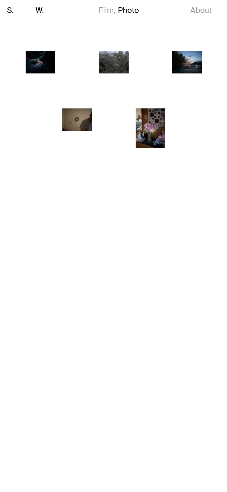 The mobile version maintains the minimalist white aesthetic but features a simplified navigation menu at the top. The photography grid shifts to a vertical orientation, stacking the images in a single column to fit the narrow screen width. The overall layout is streamlined for vertical scrolling on a handheld device.