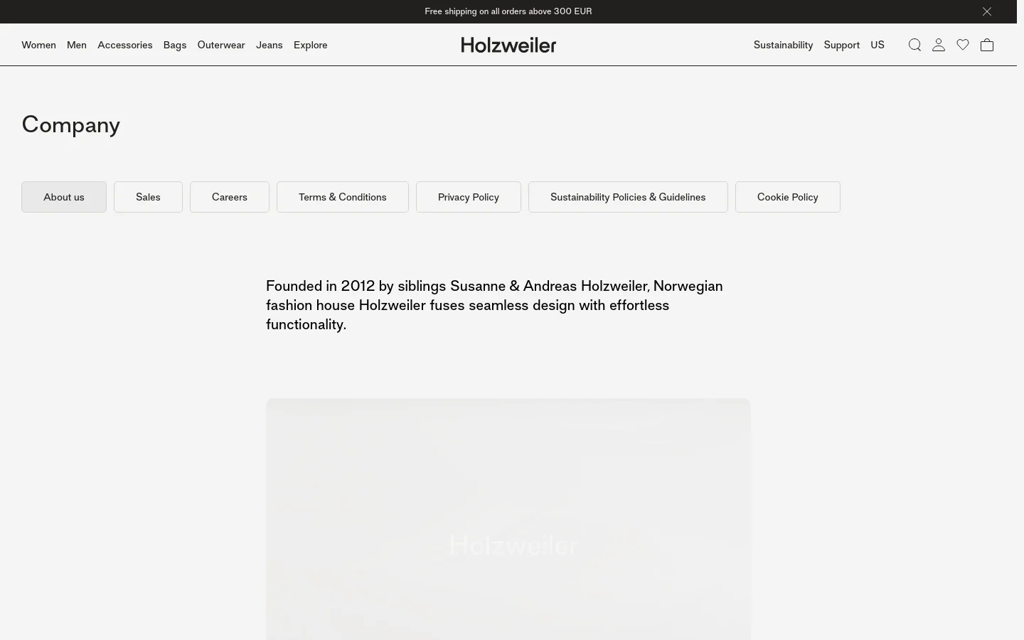 The desktop page features a minimalist white layout with a top navigation bar containing brand links and icons. Below a large 'Company' headline, a horizontal row of light gray buttons provides links to About us, Sales, Careers, and legal policies. The main body contains centered black text describing the brand's history, followed by a large, soft-focus lifestyle image.