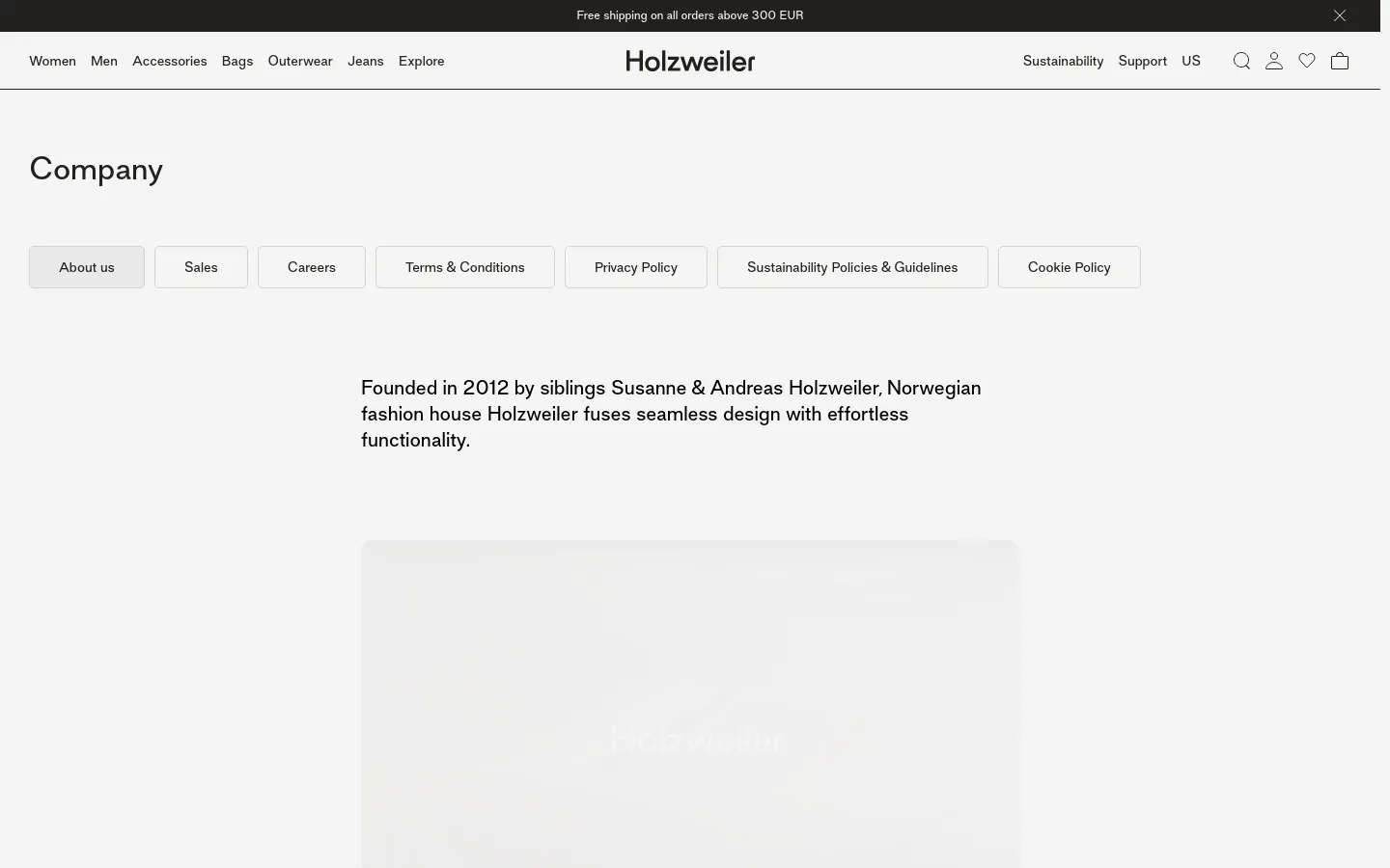 The desktop page features a minimalist white layout with a top navigation bar containing brand links and icons. Below a large 'Company' headline, a horizontal row of light gray buttons provides links to About us, Sales, Careers, and legal policies. The main body contains centered black text describing the brand's history, followed by a large, soft-focus lifestyle image.
