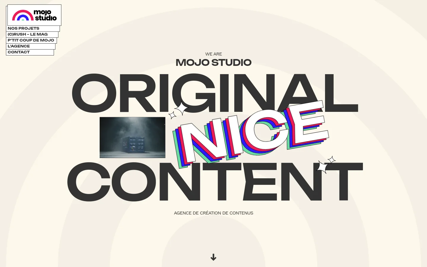 The desktop homepage features a minimalist cream background with large, bold black typography reading 'WE ARE MOJO STUDIO ORIGINAL NICE CONTENT'. The word 'NICE' is stylized with colorful 3D offset layers, and a navigation menu is positioned on the top left. A downward arrow at the bottom center encourages scrolling to view the agency's content creation projects.