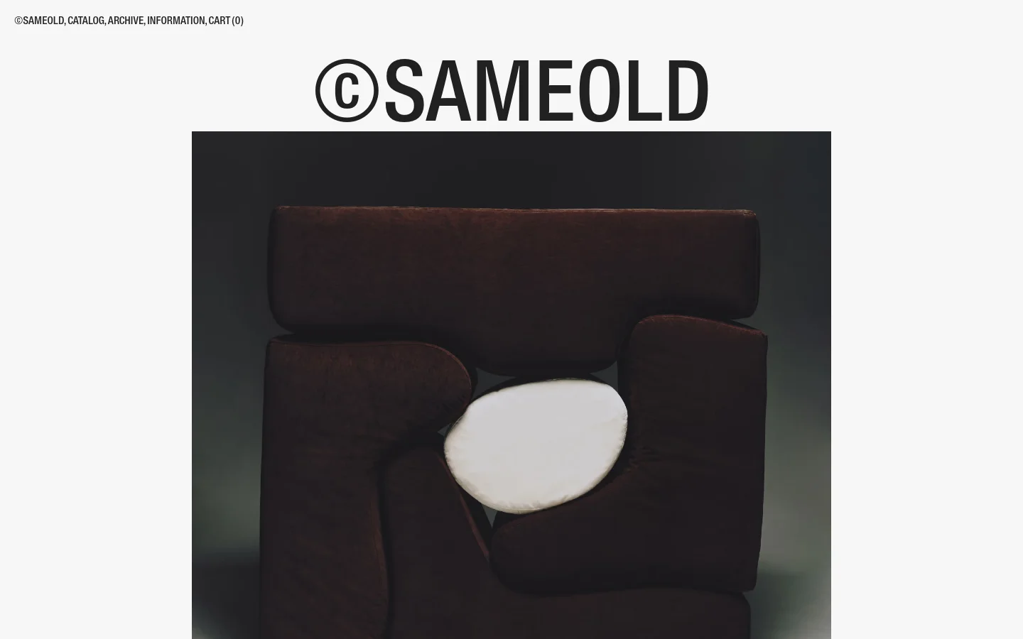 The desktop homepage for ©SAMEOLD features a minimalist design with a large hero image of a dark brown 'Malitte' system chair. Below the hero image, a large headline identifies the piece, followed by a grid of product listings including chairs and lamps. Navigation links for Catalog, Archive, and Cart are positioned at the top of the page against a clean white background.