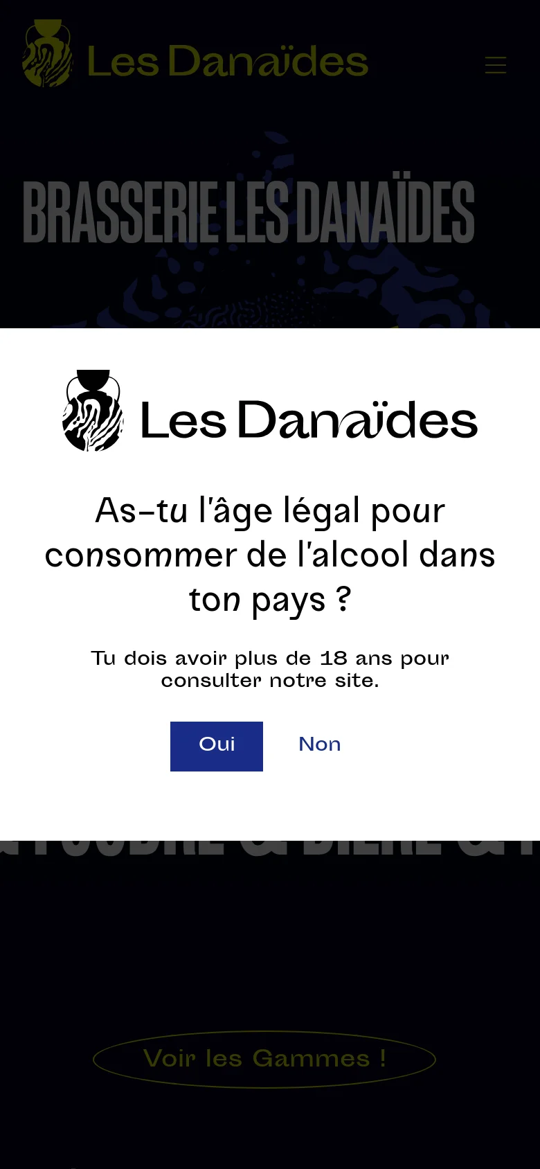The mobile version shows a simplified layout with a centered age verification modal covering most of the screen. The background features the brewery's name in large grey text and a hamburger menu icon in the top right. The design maintains the dark color palette and high-contrast yellow and white text for readability on small screens.