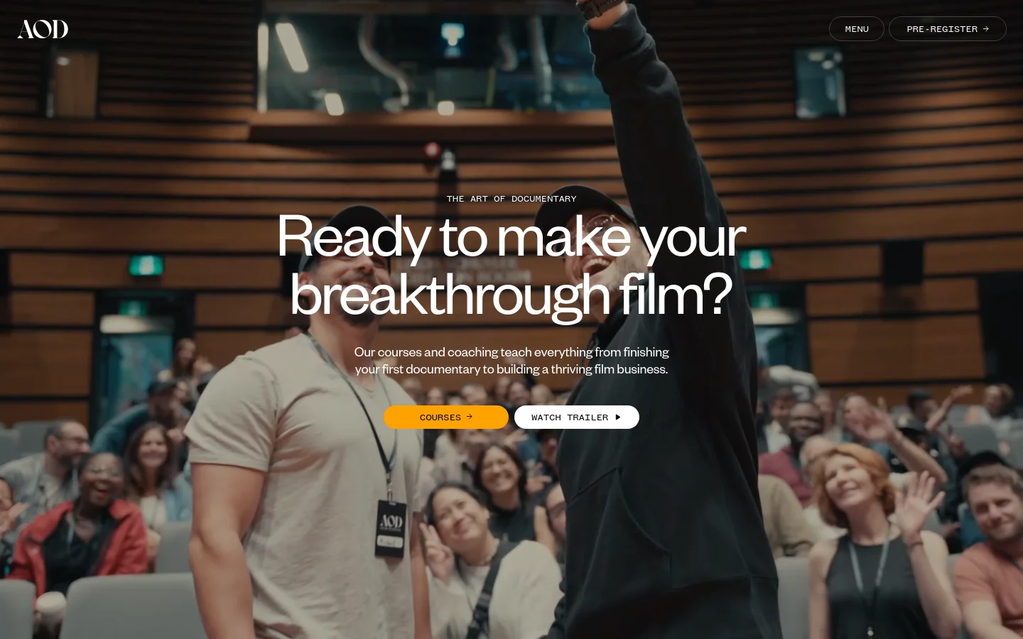 The desktop homepage features a large hero image of a filmmaker celebrating in a crowd, overlaid with the headline 'Ready to make your breakthrough film?' and two buttons: an orange 'Courses' button and a white 'Watch Trailer' button. Below the hero section, the layout includes text columns explaining how the program helps filmmakers, a statistics section with large numbers, and a series of testimonial cards featuring portraits and quotes. The design uses a dark, cinematic aesthetic with white text.