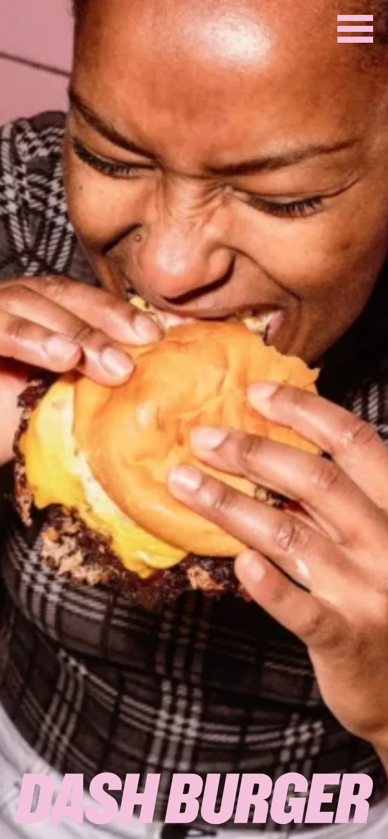 The mobile version displays a vertically oriented hero image of a person eating a burger, filling most of the screen. The navigation is condensed into a white hamburger menu icon in the top right corner, and the large pink 'DASH BURGER' branding remains prominent at the bottom.
