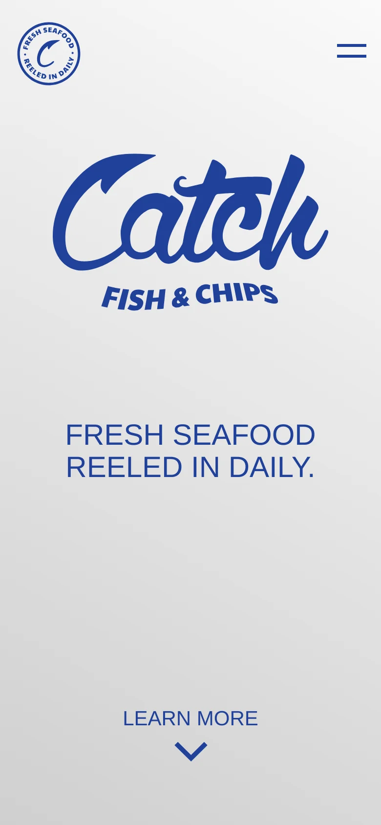The mobile version displays a large blue 'Catch Fish & Chips' logo centered on a light grey background. Below the logo, the headline 'FRESH SEAFOOD REELED IN DAILY.' is prominently featured, followed by a 'LEARN MORE' button with a downward arrow. A hamburger menu icon is located in the top right corner.