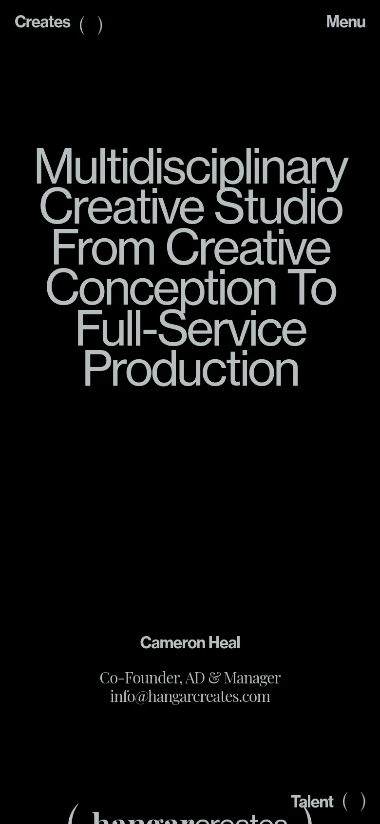 The mobile version maintains the black background and white text but uses a stacked vertical layout. The large headline dominates the upper half of the screen, followed by the co-founder's information, and a 'Menu' button replaces the top navigation bar. The layout is simplified for a single-column scroll.
