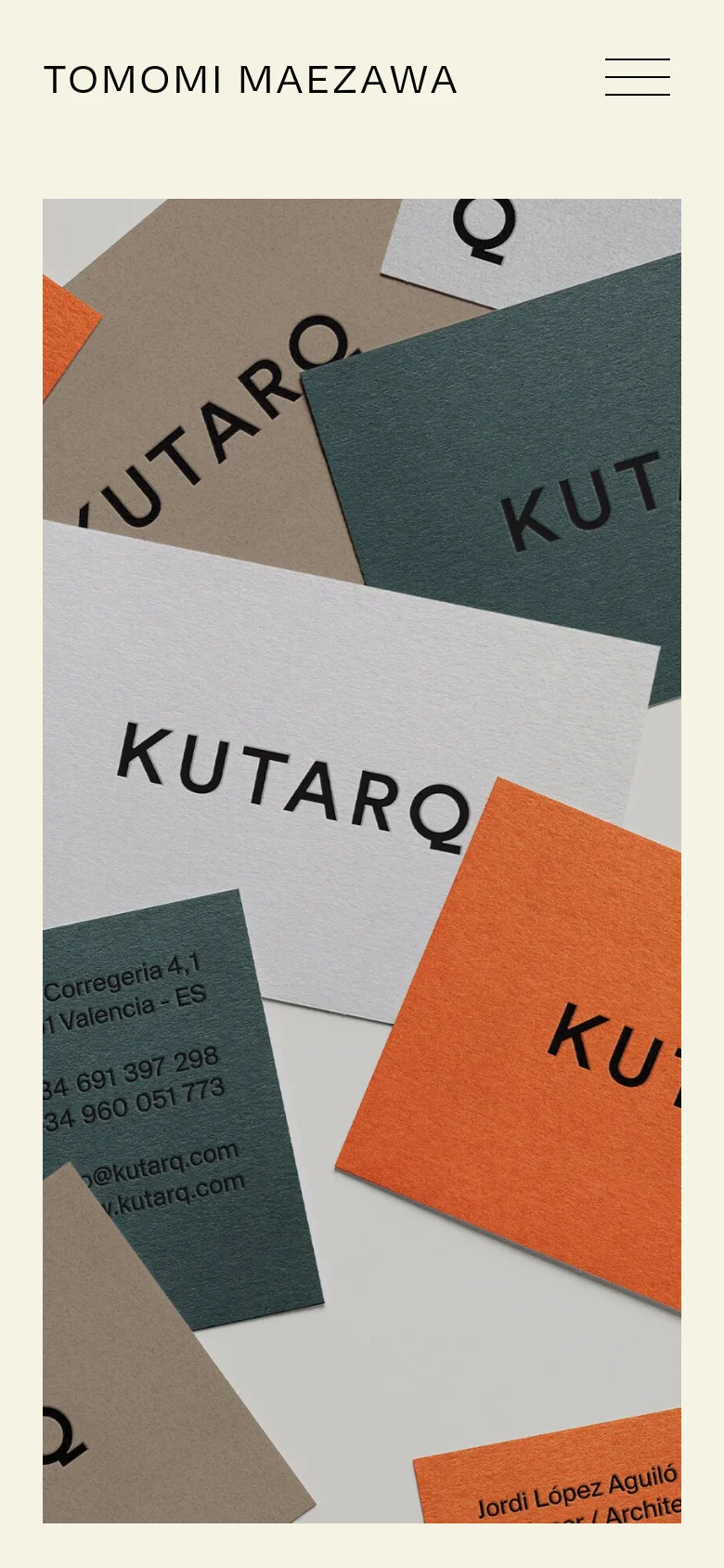 The mobile version features a simplified layout with the studio name 'TOMOMI MAEZAWA' on the left and a hamburger menu icon on the right. Below the header, a large vertical image shows a close-up, cropped view of the KUTARQ business card arrangement.