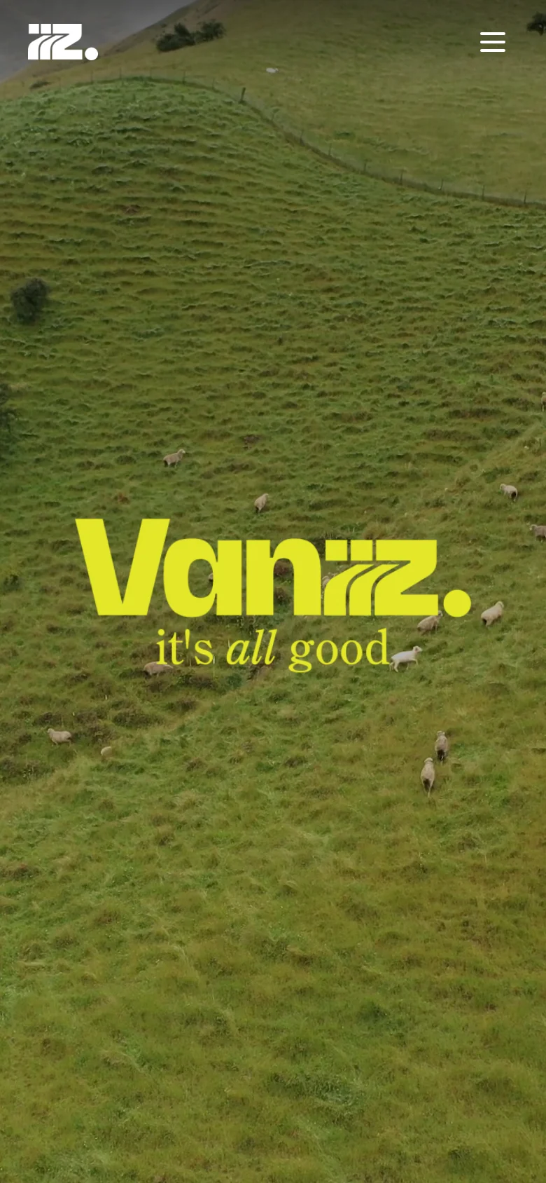The mobile version shows the same green hillside hero image and yellow Vanzzz logo, but the navigation links are hidden behind a hamburger menu icon in the top right. The company logo is positioned in the top left corner.
