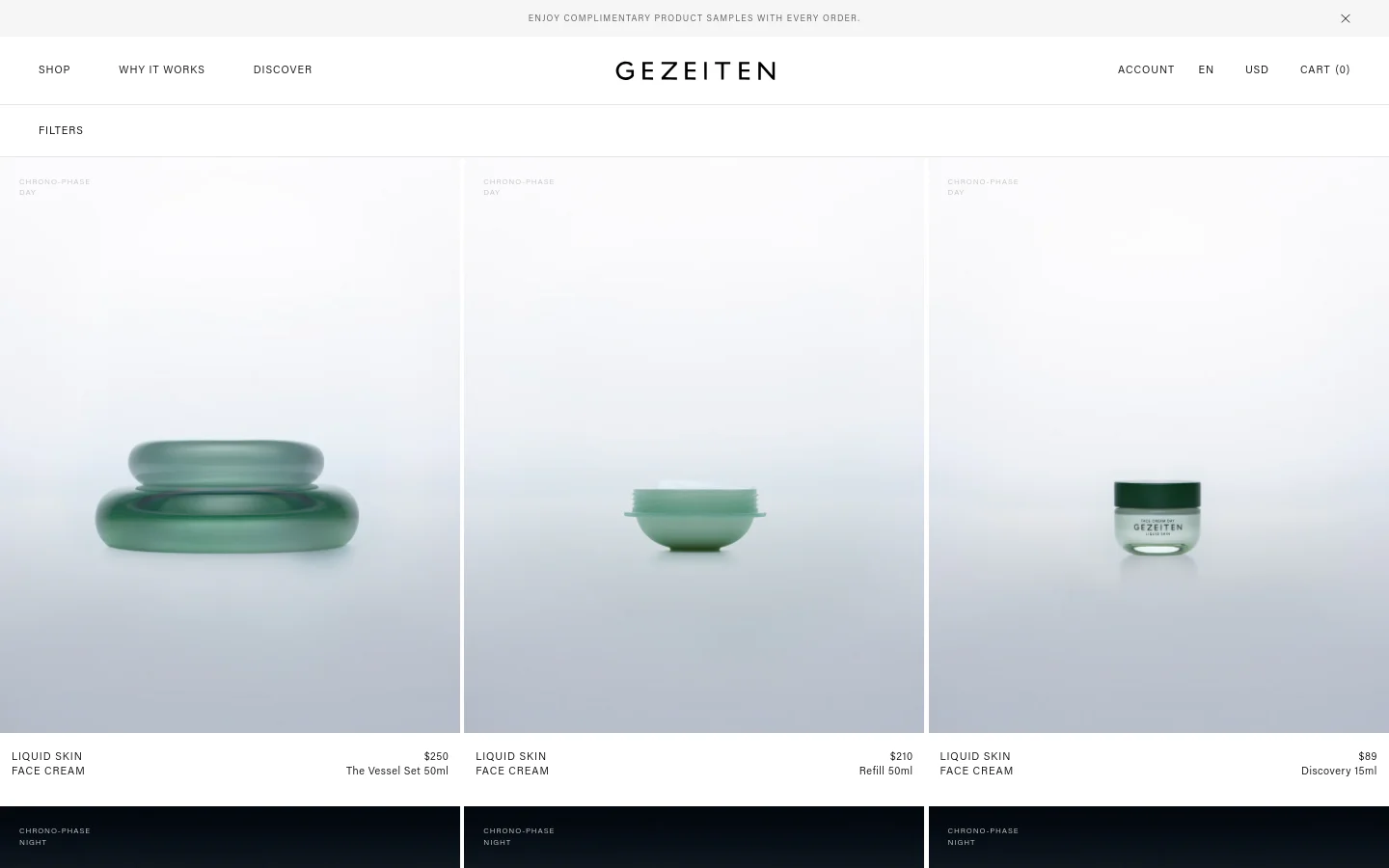 The desktop product collection page features a minimalist design with a white background and a clean navigation bar at the top. A grid of skincare products is displayed, each showing a high-quality image of green glass vessels against a soft, light background, accompanied by product titles, prices, and descriptions. The layout is spacious, emphasizing the high-end aesthetic of the brand.