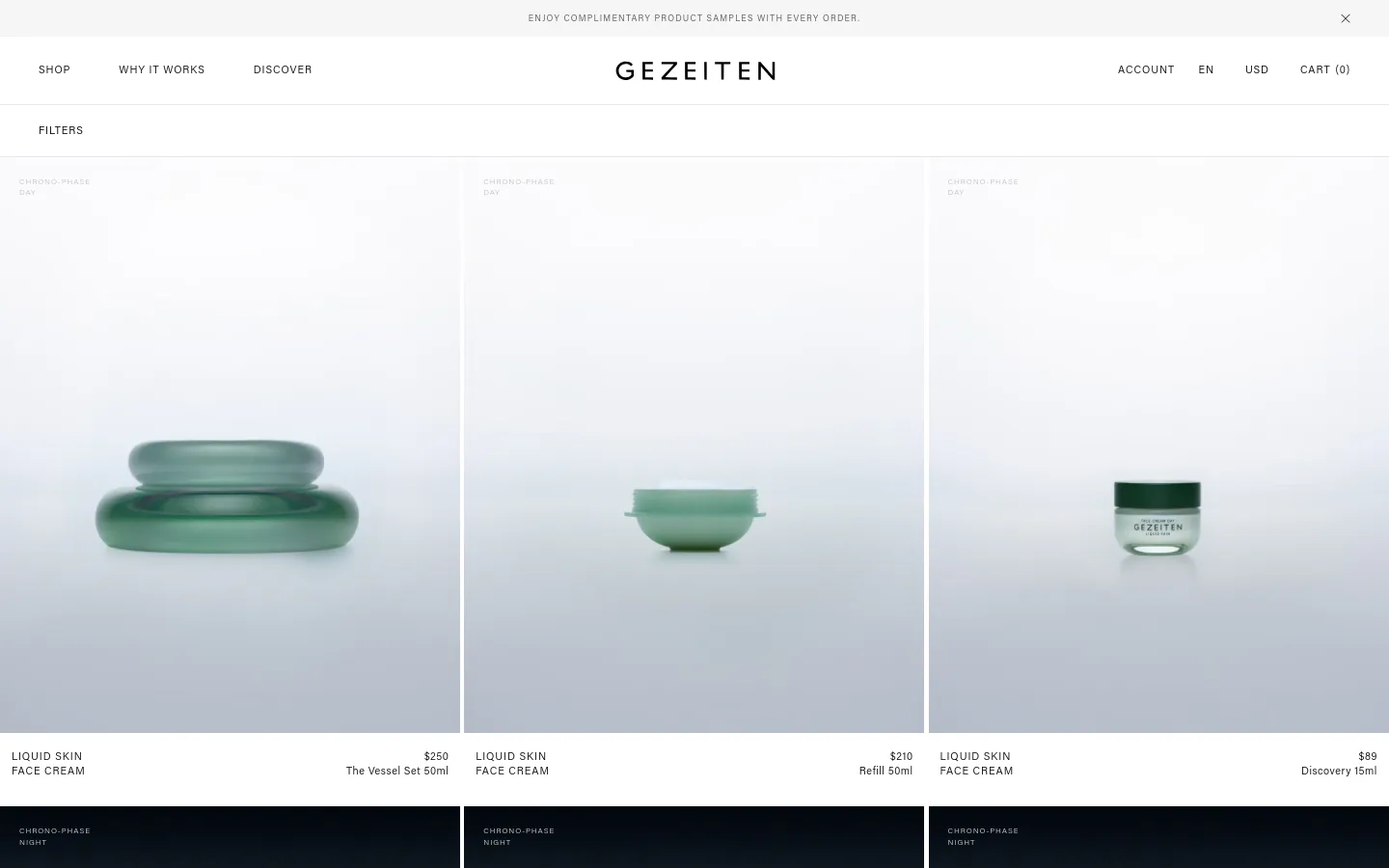 The desktop product collection page features a minimalist design with a white background and a clean navigation bar at the top. A grid of skincare products is displayed, each showing a high-quality image of green glass vessels against a soft, light background, accompanied by product titles, prices, and descriptions. The layout is spacious, emphasizing the high-end aesthetic of the brand.
