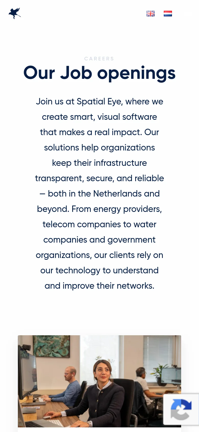 The mobile version presents a vertically stacked layout optimized for small screens. The 'Our Job openings' headline and mission statement are centered and take up the top portion of the screen, followed by a single large office photo below. The navigation menu is condensed, and the language icons are positioned near the top.