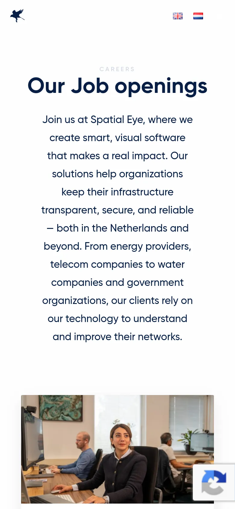 The mobile version presents a vertically stacked layout optimized for small screens. The 'Our Job openings' headline and mission statement are centered and take up the top portion of the screen, followed by a single large office photo below. The navigation menu is condensed, and the language icons are positioned near the top.