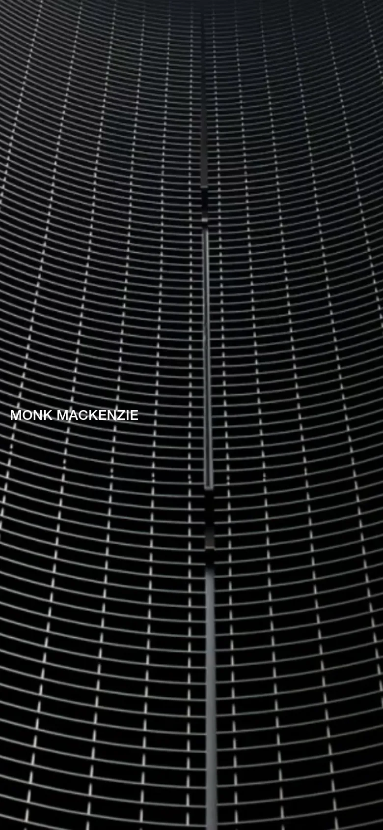 The mobile version maintains the dark, textured metallic grid background. The layout is vertically oriented, with the 'MONK MACKENZIE' brand name positioned prominently on the left side of the screen.