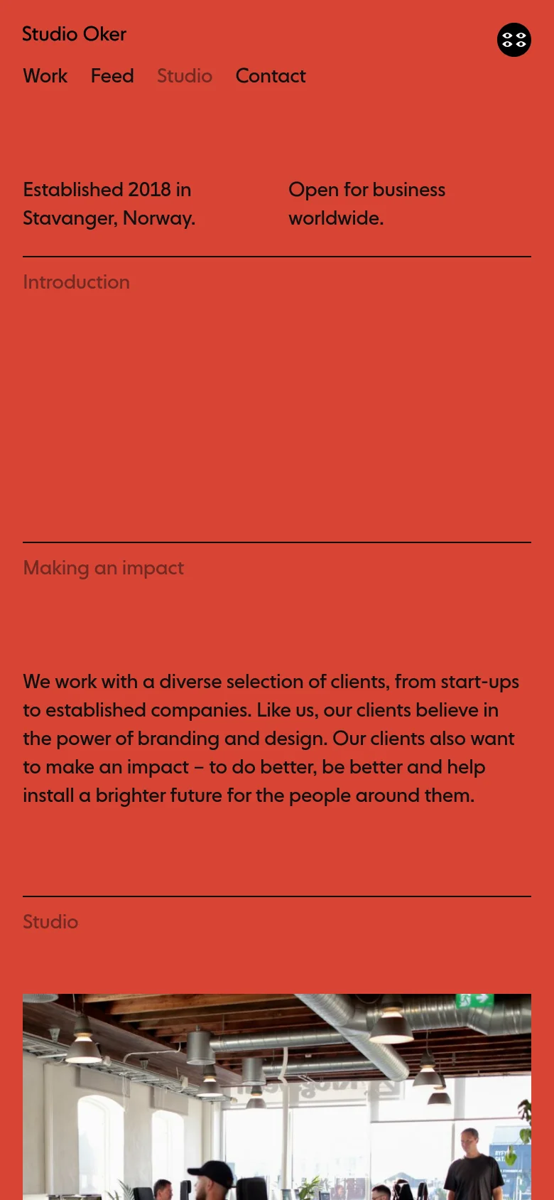 The mobile version maintains the high-contrast orange and black color scheme but uses a vertical, single-column layout. The navigation menu is condensed, and the large headline text scales down to fit the narrower screen width. Content sections like 'Making an impact' are stacked vertically for easier scrolling on a handheld device.