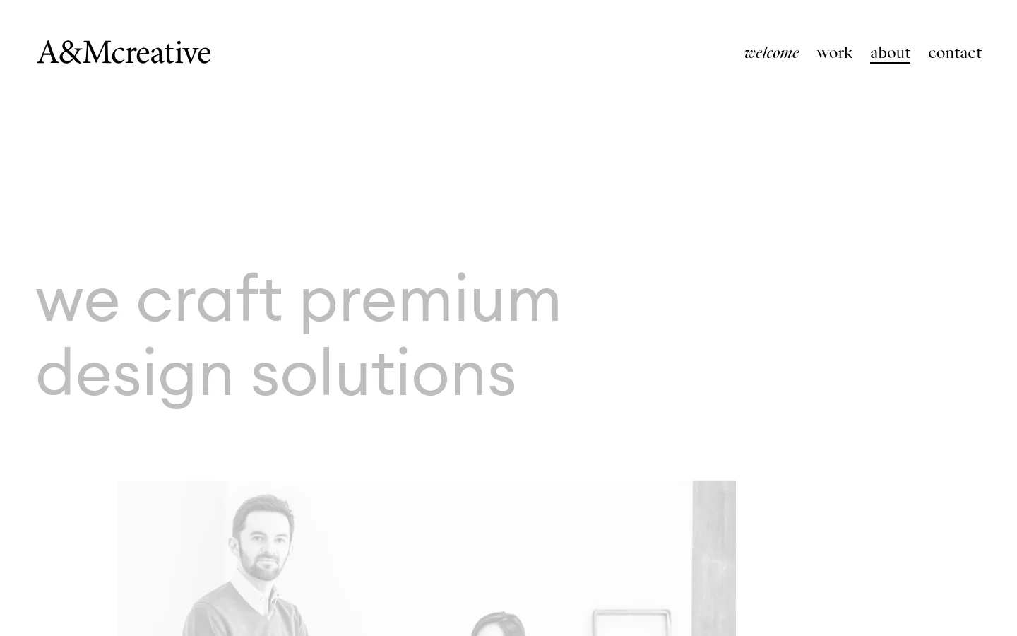 The desktop About page features a minimalist white layout with the 'A&Mcreative' logo on the left and navigation links on the right. A large, light gray headline reads 'we craft premium design solutions' above a black and white hero photograph of the founders, Alexis and Min, in a studio setting. Below the image, biographical text describes their professional backgrounds and the founding of the agency.