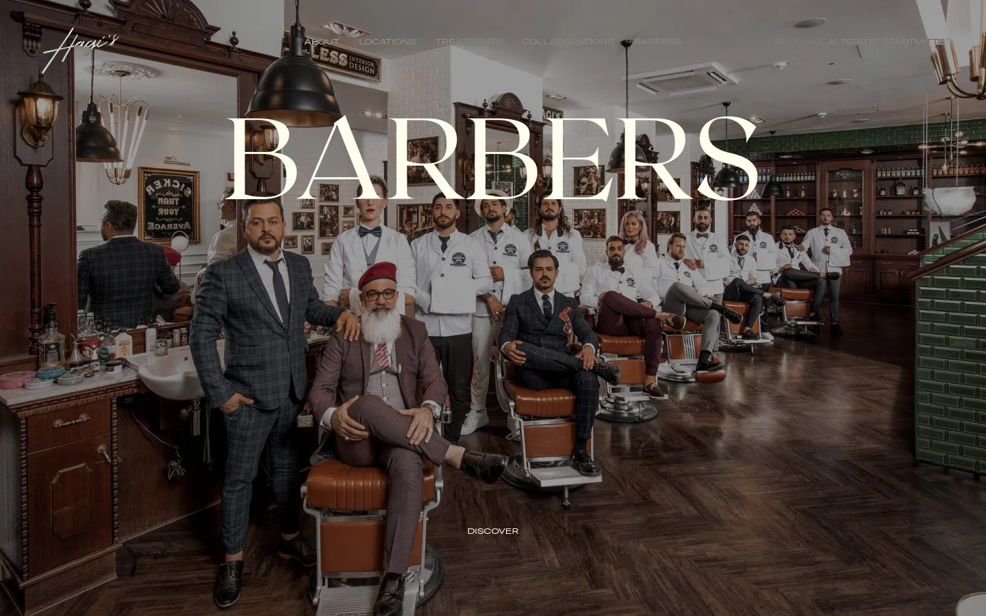 The desktop page features a large hero image of the barber team posing in a vintage-style barbershop with dark wood and leather chairs. Below the hero, the 'Stadtmitte' section displays a grid of individual barber portraits, each accompanied by their specialties and a 'Book an Appointment' link. The design uses a sophisticated palette of dark wood tones, white, and leather brown.
