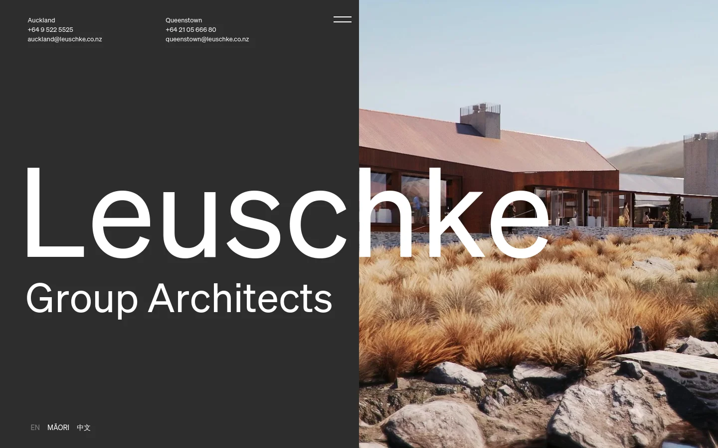 The desktop homepage features a split-screen layout with a dark charcoal left side containing the large white 'Leuschke Group Architects' title and contact details for Auckland and Queenstown. The right side displays a high-quality architectural photograph of a modern building nestled among golden grasses under a clear sky.