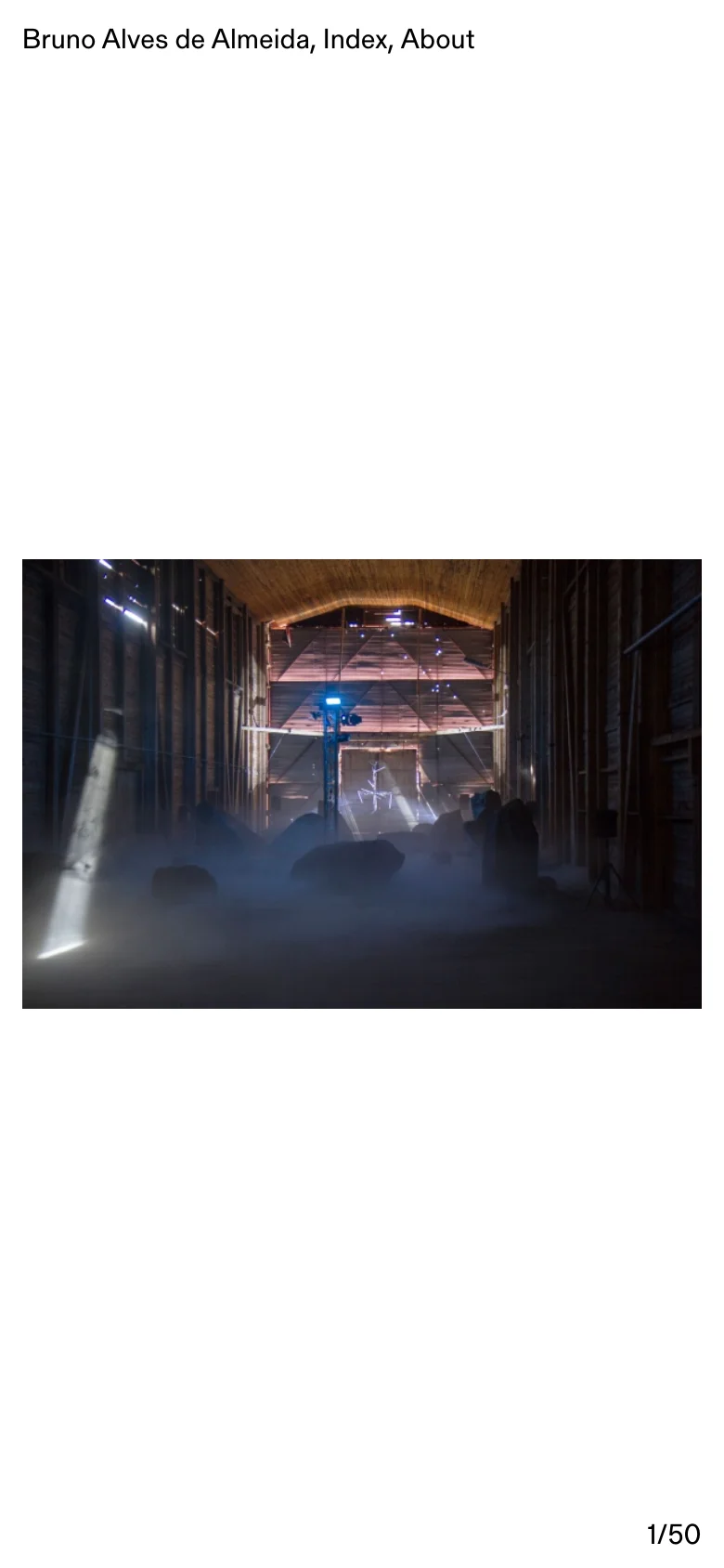 The mobile version maintains the minimalist white aesthetic but stacks the content vertically. The navigation links are positioned at the top, and the hero image and subsequent art installation photos are scaled to fit the narrower width of the screen.