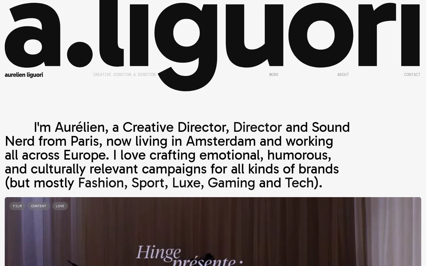 The desktop homepage features a minimalist white background with large, bold black typography for the name 'a.liguori'. A prominent text section introduces Aurélien, followed by a grid of large, high-quality project tiles showcasing diverse work in film, social, and tech. Navigation links for Work, About, and Contact are spaced across the top header.