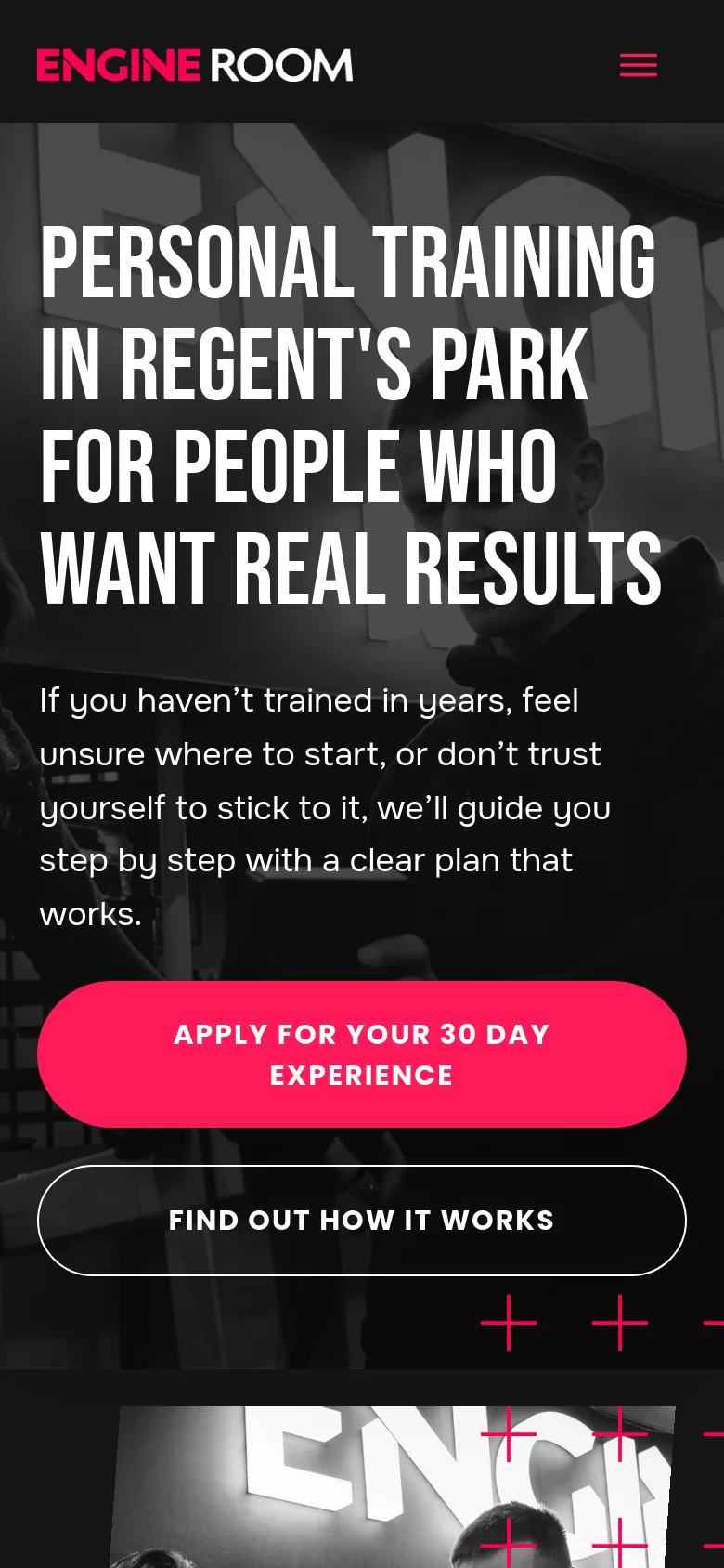 The mobile version uses a vertical layout with the same dark aesthetic and black and white gym imagery. The headline and text are centered and stacked vertically to fit the narrow screen. The two call-to-action buttons are also stacked on top of each other, with the pink 'APPLY' button appearing above the outlined 'FIND OUT HOW IT WORKS' button.