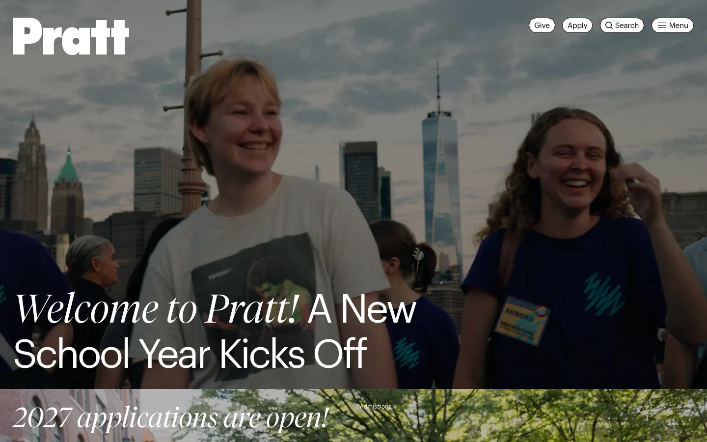 The Pratt Institute homepage features a large hero image of smiling students against a New York City skyline. A navigation bar at the top includes the Pratt logo, 'Give' and 'Apply' buttons, a search icon, and a menu button. Below the hero section, content modules include news about the new school year, admissions for 2027, and alumni stories with large, high-quality photography.